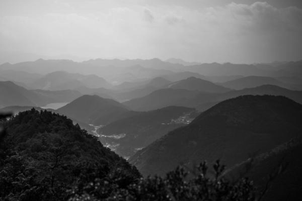 A black and white photograph looking over the Kii Valley