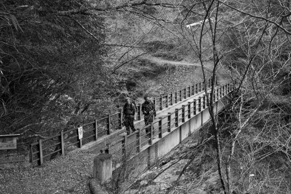 Dan Rubin and Matt Mullenweg walking over a bridge near Koya-san